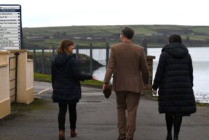 3 people walking towards the Hub in Cooleen