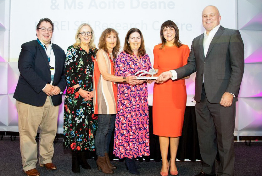 Hub and MaREI staff lined up for a photo as they receive the award.