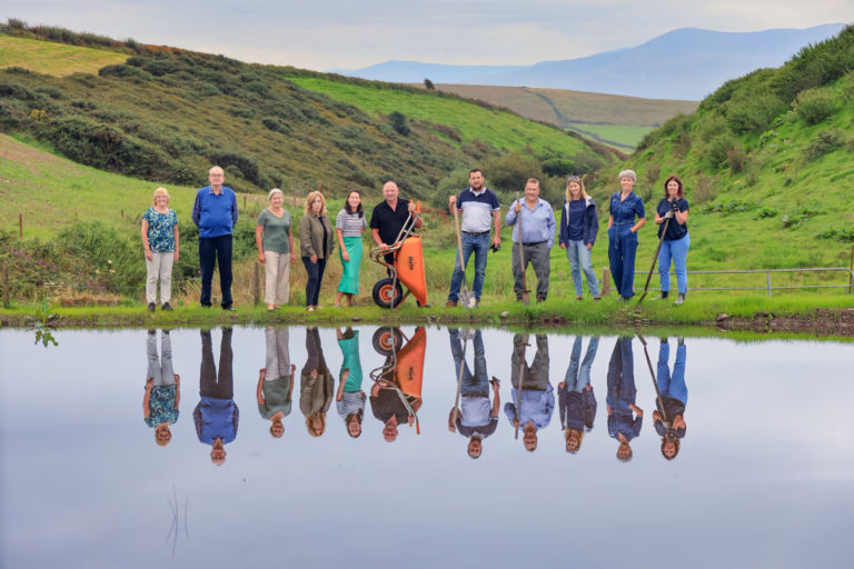 Ireland’s Greenest Places 2025: Máire Uí Mhurchú, Val Behan, Fionna Sheehy, Catríona Fallon, Ann Ní Chiobhán, Dinny Galvin, Tommy Reidy, Martin Bealin, Martha Farrell, Grainne Kelliher and Deirdre de Bhailís at the newly created pond for biodiversity at Dinny Galvin's farm. Photograph: Valerie O'Sullivan